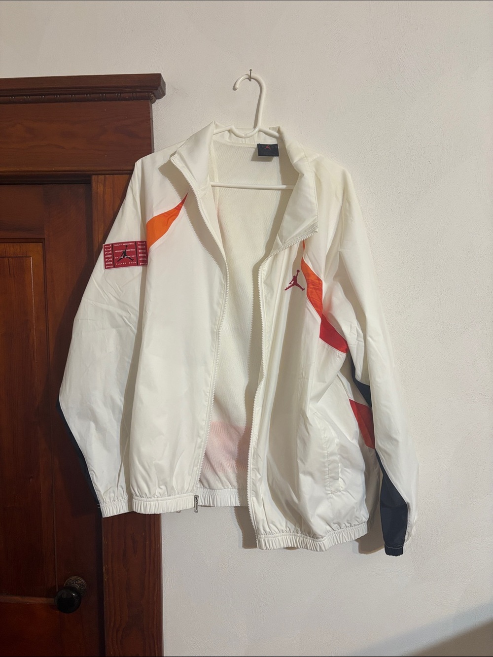 Jordan White Windbreaker with Orange and Red Accents